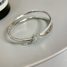 Charger l&#39;image dans la galerie, Elegance Redefined: Silver Pavé Knot Bangle Bracelet
