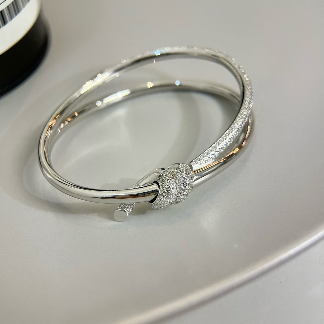 Elegance Redefined: Silver Pavé Knot Bangle Bracelet
