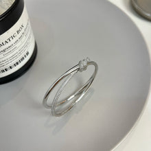 Load image into Gallery viewer, Elegance Redefined: Silver Pavé Knot Bangle Bracelet
