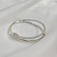 Load image into Gallery viewer, Elegance Redefined: Silver Pavé Knot Bangle Bracelet
