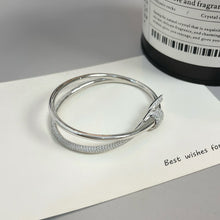 Lade das Bild in den Galerie-Viewer, Elegance Redefined: Silver Pavé Knot Bangle Bracelet
