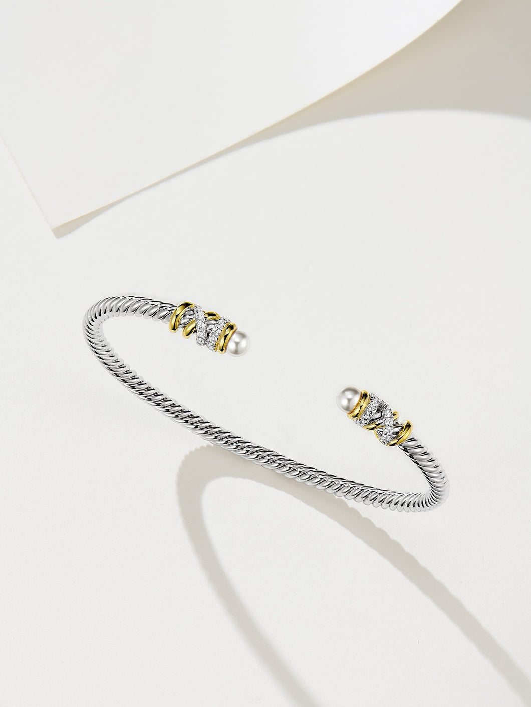 Elegant Silver Bracelet with Gold Plating, Swarovski Pearls, and Zirconia